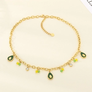 Detail of gold chain necklace featuring green enamel avocado charms and small colorful beads