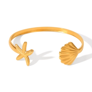 Gold stainless steel starfish and seashell open cuff bracelet on white background