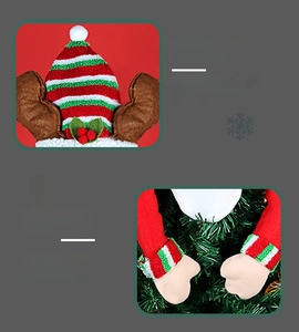 Detail showing reindeer antlers and holly leaf accents on a knitted Christmas topper