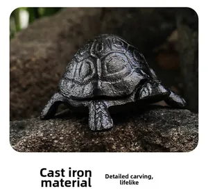 Close-up of vintage cast iron turtle storage box with detailed shell texture and dark finish