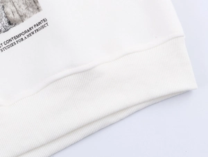 Detailed macro view of white cotton sweatshirt ribbing with contemporary paints print