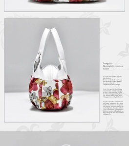 Detail of floral printed handbag featuring silver metal rings and secure zipper closure