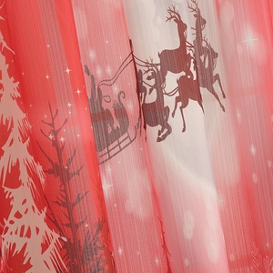 Macro detail of Christmas curtain fabric showing reindeer and snowflake mesh texture