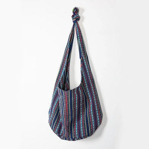Detail of striped ethnic canvas tote bag showing thick fabric texture and blue vertical patterns
