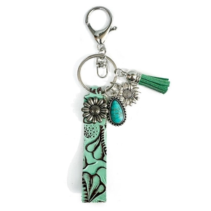 Porte-clés vintage en cuir avec breloque tournesol et pompon turquoise élégant