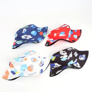 Set of four reversible tie-dye bucket hats with colorful graffiti prints for sun protection