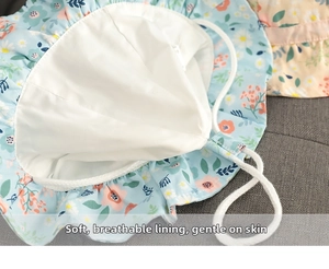 Detail of floral baby sun hat showing soft white inner lining and sewing quality