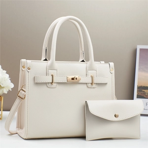 Elegant white litchi leather handbag set with gold hardware and matching pouch