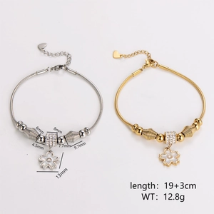 Floral charm bracelet in silver and gold plating with snake chain and crystal accents