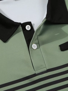Close-up of olive green piqué polo shirt with black collar and striped chest pattern
