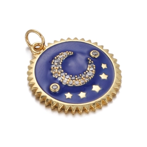 Macro view of blue enamel pendant with gold star and moon patterns inlaid with zircons
