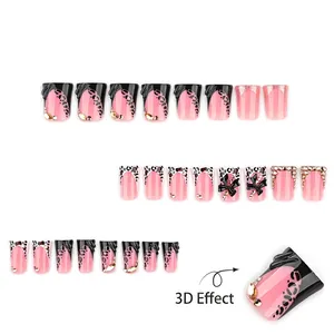 Pink and leopard print y2k press-on nails with 3D black bows and sparkling rhinestones
