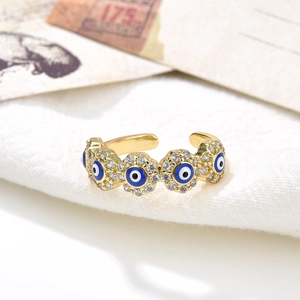 18K gold plated adjustable ring with blue evil eye charms and sparkling zircon accents