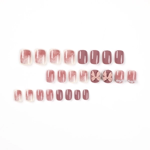 Short square pink press-on nails set with marble texture, 3D bows and pearl accents