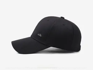 Side view of black baseball cap with structured six-panel crown and metal logo detail