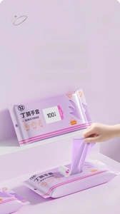 Macro shot of purple nitrile gloves in a tissue-style pull-out box for easy access