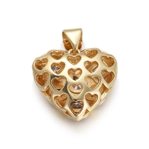 Detailed macro view of an 18K gold hollow heart pendant with sparkling crystals