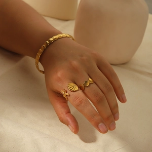 18K gold plated ocean series jewelry set featuring starfish shell rings and wave cuff bangle