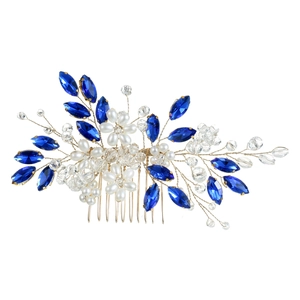 Close-up of handmade bridal hair comb with blue crystal leaves and white pearls