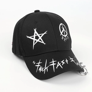 Close-up of black streetwear baseball cap with white graffiti patterns and three metal rings