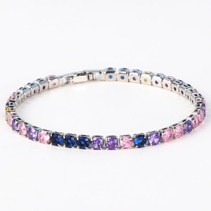 Macro view of silver tennis bracelet with colorful pavé cubic zirconia and box clasp