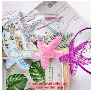 Detail of four colorful sequined starfish headbands including silver, pink, blue, and purple