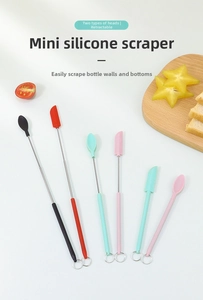 Mini telescopic silicone spatulas in four colors displayed on a rustic wooden tray