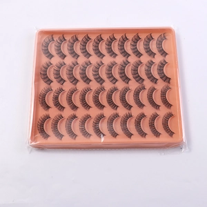 Close-up of 20 pairs of dense Russian volume fiber eyelashes in an orange tray packaging