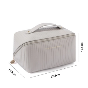 Vertical striped large capacity cosmetic travel bag in beige faux leather with gold accents