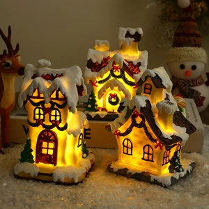Lighted Christmas resin village house set with warm LED glow for festive tabletop decor
