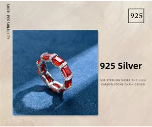 Macro detail of S925 sterling silver ring featuring emerald-cut red stones and accents