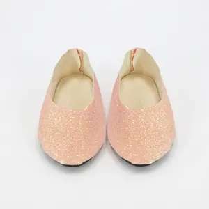 Close-up of pink and gold glitter doll shoes for 18 inch American Girl dolls with black soles