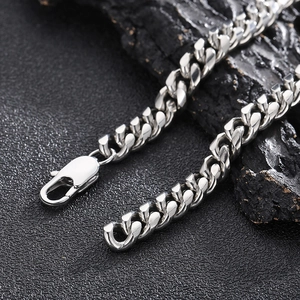 Detailed view of silver stainless steel Cuban link chain with a sturdy lobster clasp