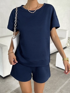 Detail of navy blue knitted lounge set for women featuring unique diamond texture fabric