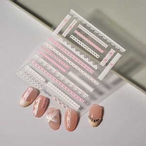 Close-up of 5D white and pink lace nail stickers featuring FEB-759 floral patterns