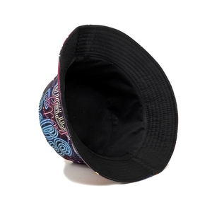 Double-sided reversible bucket hat with colorful neon graffiti print and black cotton lining