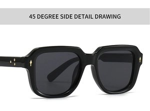 Detail view of black thick frame sunglasses with decorative golden metal rivets