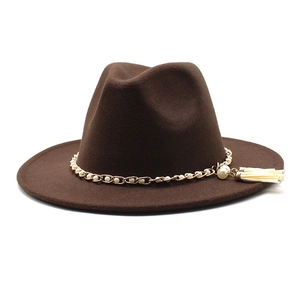 Detail of dark brown wool Fedora hat featuring pearl chain trim and stylish tassel accents