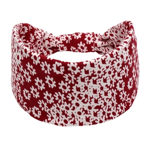 Detailed view of red floral yoga headband made of soft, stretchy fabric for women