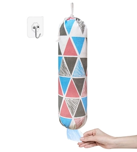 Wall-mounted canvas grocery bag holder showing convenient bottom dispensing of plastic bags