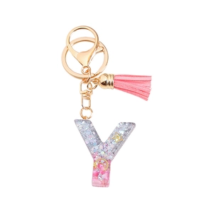 Glitter resin letter Y keychain with pink tassel and gold hardware on white background