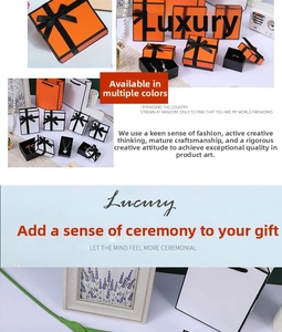 Detailed view of orange and white jewelry gift boxes with black borders and elegant bows