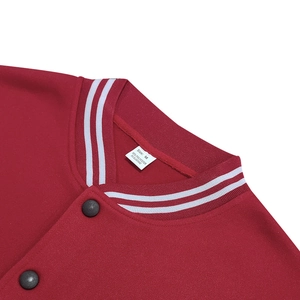 Close-up of red baseball jacket ribbed collar with stripes and black matte buttons detail