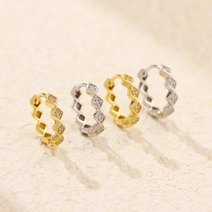 Detailed close-up of geometric S925 silver hoop earrings with sparkling zircon stones