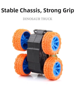 Detailed bottom view of dinosaur truck chassis with large orange off-road tires