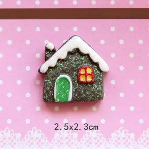 Detailed view of resin gingerbread house with green glitter for DIY crafts and ornaments