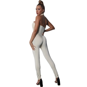 Beige halter backless jumpsuit for women featuring slim fit stretch fabric back view