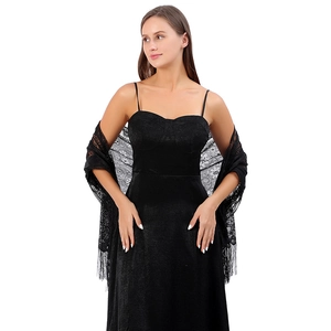 Close-up of black lace shawl with intricate paisley patterns and delicate fringe trim