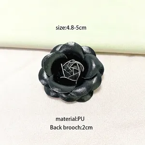Vintage gold camellia flower brooch in premium PU leather for elegant women outfits