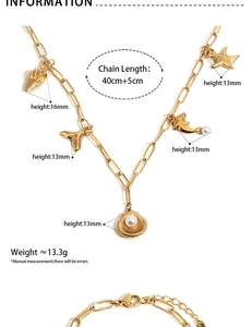 Detailed specs of gold ocean charms necklace with paperclip chain and shell pendants